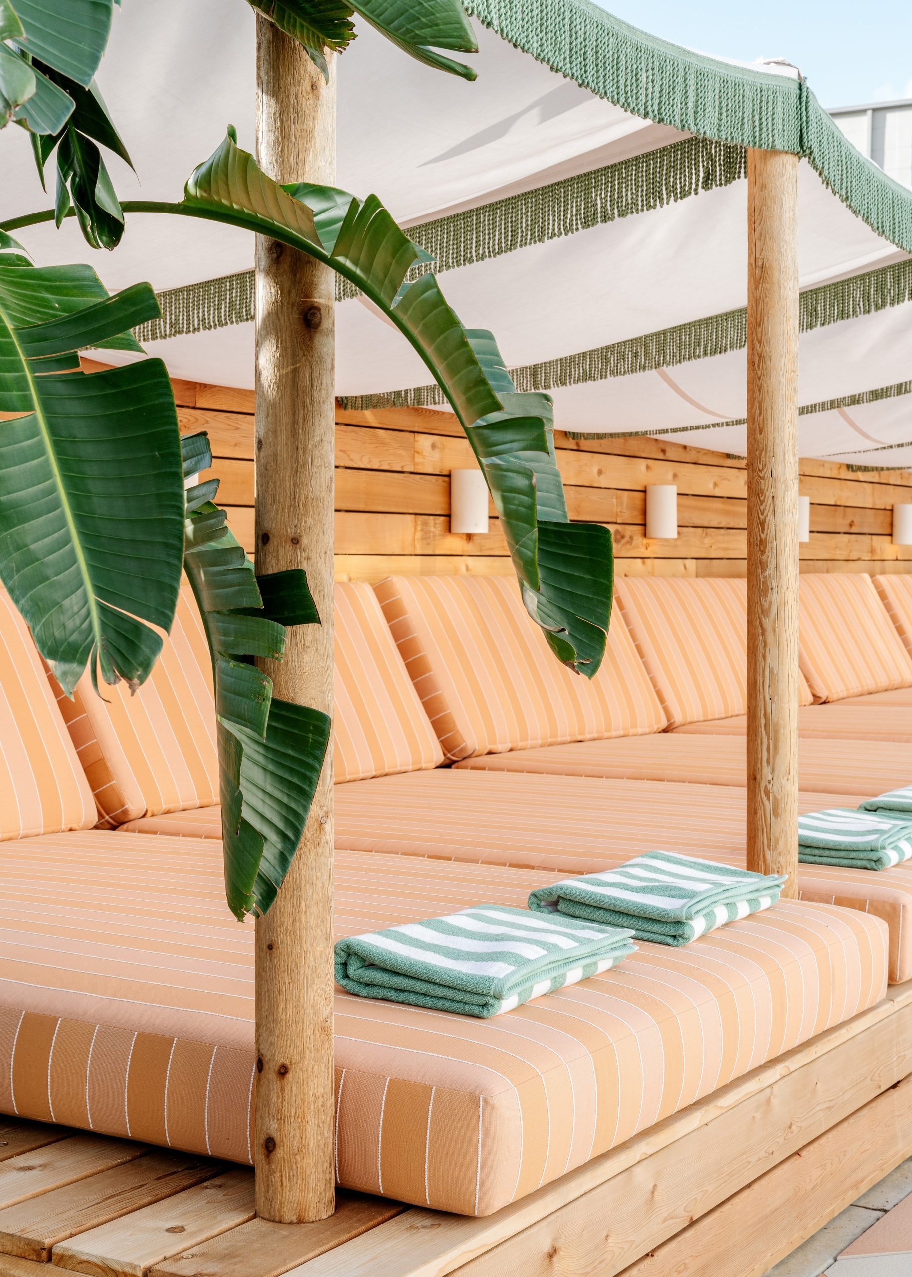 Cedar cabana structure with striped cushions