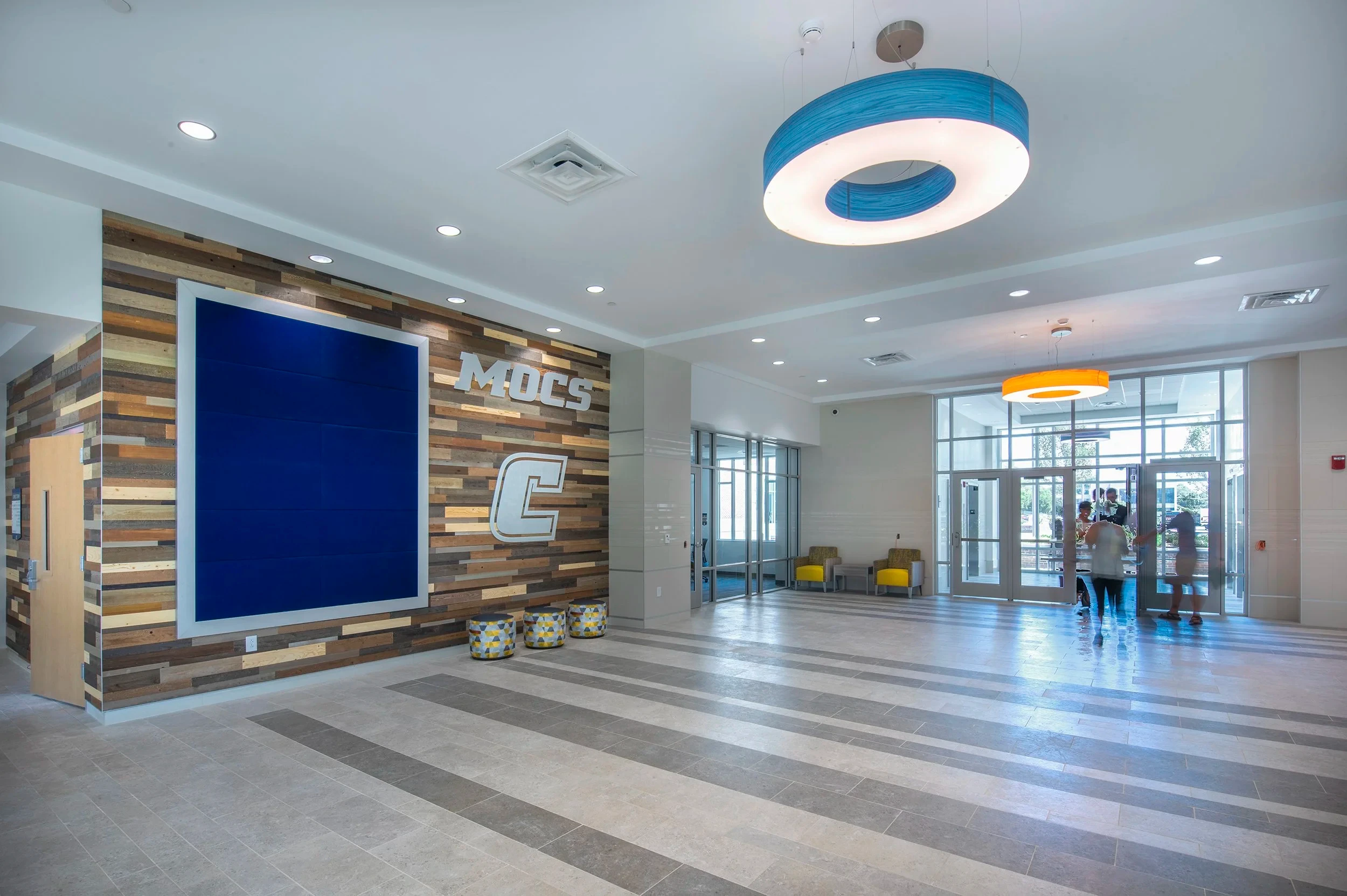 Upper-floor lounge with reclaimed wood accent wall