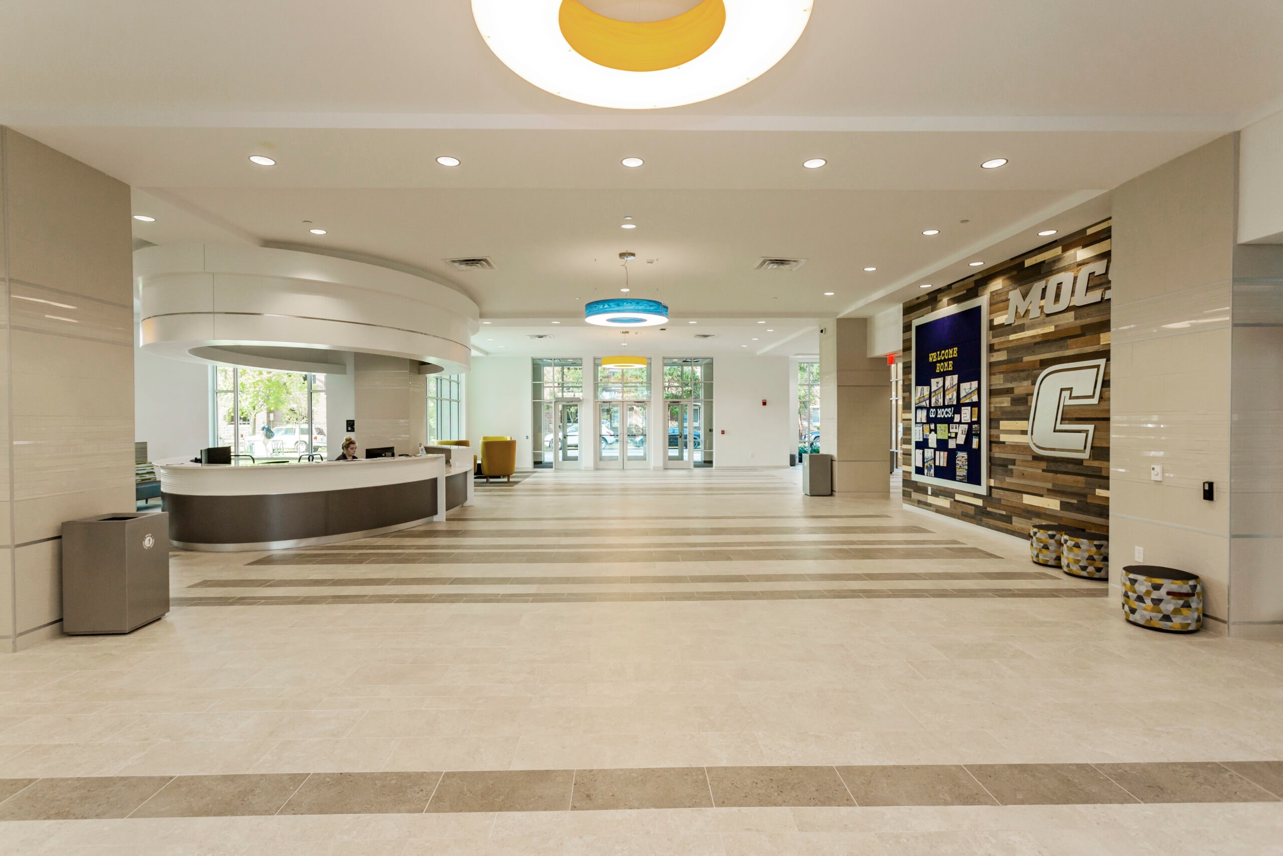 Common area — yellow booth seating and blue sofas